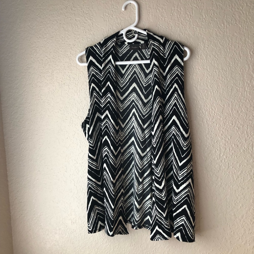 Chico’s sleeveless black print knit vest.